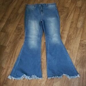 Fashion Nova Distressed Flare Jeans in Blue